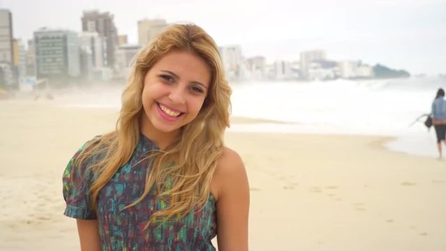 Young Brazilian woman smiles on a beach in Brazil