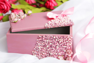 Beautiful casket on white fabric