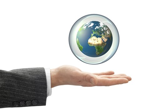 business Hand holding globe in bubble