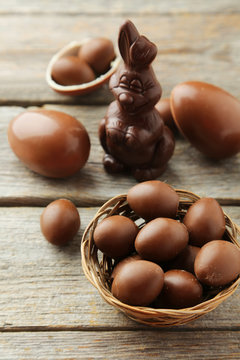 Chocolate easter eggs on grey wooden background