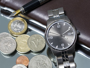 wrist watch. coin. close