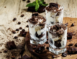Chocolate dessert with ice cream in a glass, selective focus