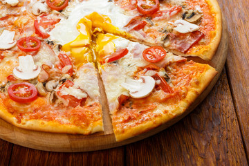 Delicious pizza with mushrooms, bacon and egg