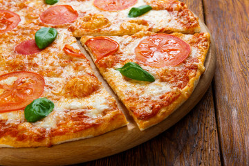 Delicious italian Margherita pizza with fresh basil