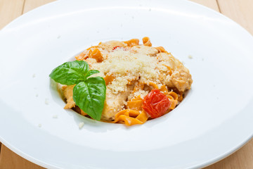 Traditional italian pasta with cured tomato
