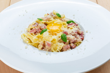Traditional italian pasta carbonara with bacon and egg