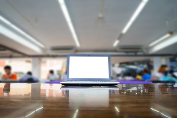 laptop with blank screen on the table in library