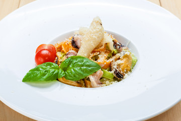 Traditional italian seafood pasta with calamari and mussel
