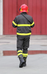 Firefighters in uniform with red helmet