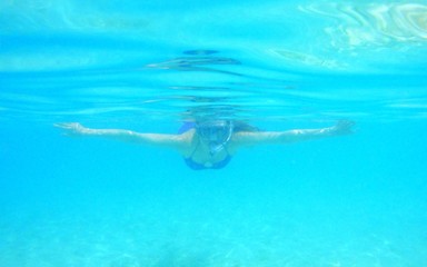 young woman snorkeling
