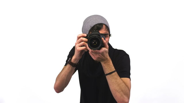 An attractive young photographer in a studio 