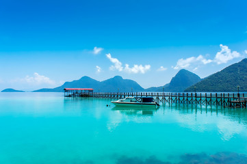 wood jetty and speed boat
