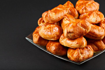 Hot tasty small russian pie baking