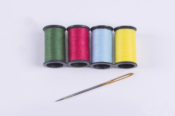 Colored threads with a needle