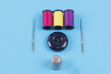 Button with needle, thimble and thread colors