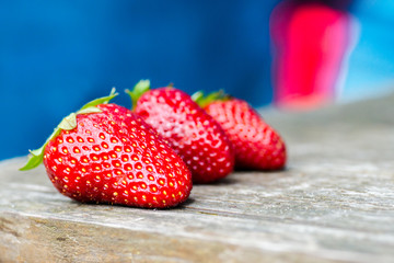 Fresh strawberries on a wood background