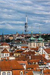 Obraz premium Aerial view: Houses with traditional red roofs in Prague. 