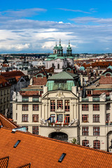 Obraz premium Aerial view: Houses with traditional red roofs in Prague. 
