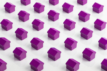 Obraz premium Grid of purple houses making a community in the property market.