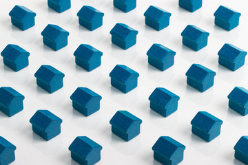 Grid of blue houses making a community in the property market.