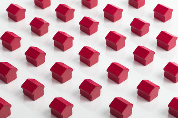 Grid of red houses making a community in the property market.