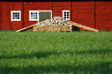 old farm with wood and timber, rural landscape in Sweden