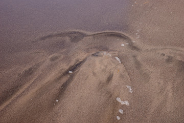 Dunkler Sandstrand