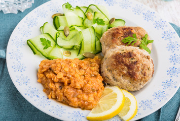 Delicious fried beef meatball, lentils and salad with fresh cucumber