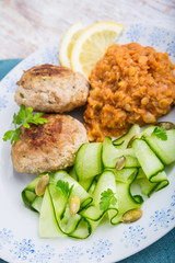 Delicious fried beef meatball, lentils and salad with fresh cucumber