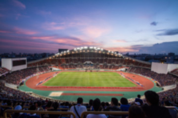 defocused of  soccer or football stadium at twilight,Thailand