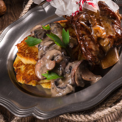 Grilled ribs with potato pancakes