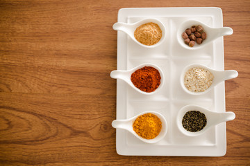 Wooden table of colorful spices