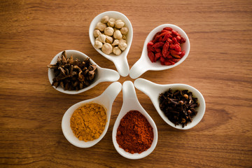 Wooden table of colorful spices