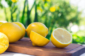 Fresh lemons on the table in the open air. Selective focus.