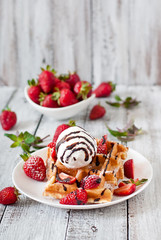 Belgium waffles with strawberries and ice cream 