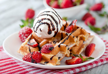 Belgium waffles with strawberries and ice cream 
