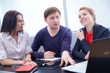 Three businessmen discussing something together