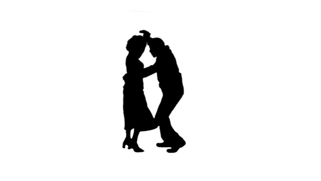 A salsa dancing couple silhouetted on blue dance energetically