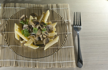 Mushroon penne rigato over the smoky plate