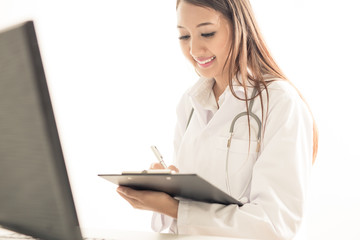 Young and professional doctor working in office