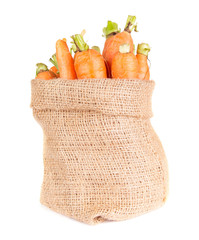 carrots in a burlap bag isolated on white background