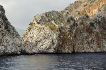 Fototapeta na wymiar Old fortress on the cliffs.