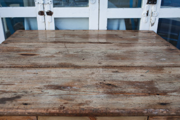 Wood Table Against Old Door