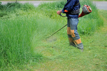 Man mows grass