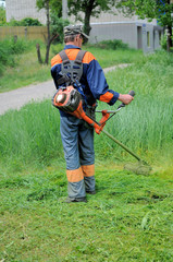 Man mows grass
