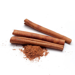 Cinnamon sticks and powder on white background