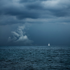 Boat Sailing in Center of Storm Formation - 84066246