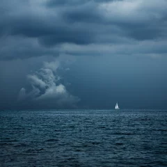 Zelfklevend Fotobehang Boat Sailing in Center of Storm Formation © Maryia Bahutskaya