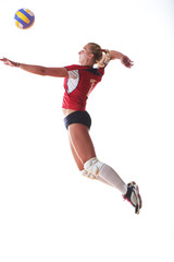 volleyball woman jump and kick ball isolated on white background