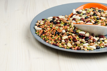 legumes in a dish on table, close up, background